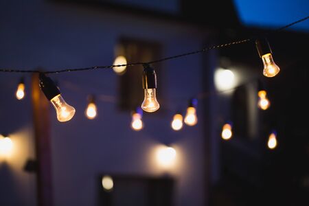 Light bulb decor in a street party at night