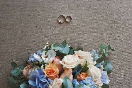 Wedding bouquet of multicolored flowers on a gray backgroundの写真素材