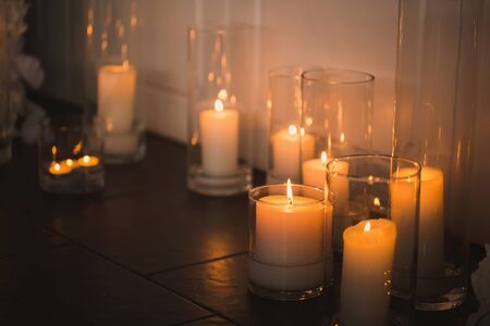 vases with candles stand for wedding ceremony.