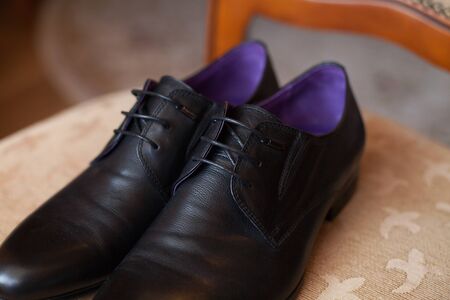 Black shoes on a chair. Wedding day.の写真素材