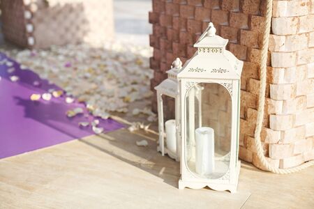 Wedding ceremony. Candles, rose petals on the floorの写真素材