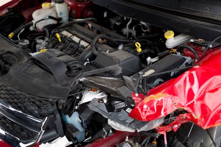 Car crash accident on street, damaged automobiles after collision in city. Car engine.