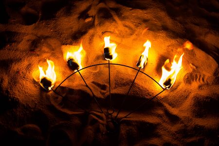 Fire Show Fire Movement. Fan of fire on the sand