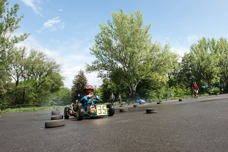 Karting - driver in helmet on kart circuit