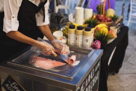 Stir-fried ice cream rolls at freeze pan. Rolled ice cream, hand made ice cream dessert. Stir-fried...