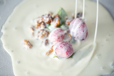 Stir-fried ice cream rolls at freeze pan. Rolled ice cream, hand made ice cream dessert. Fried ice...