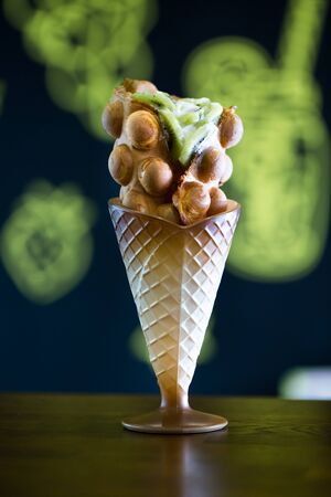 Hong Kong style egg waffle with kiwi.の写真素材