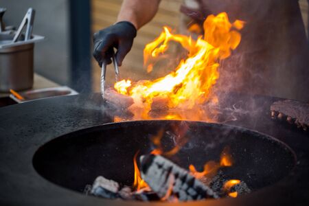 Sausage on Barbeque Smoker Grill. Hot and smoked sausage. Food Festival.の写真素材