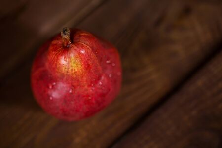 Pear red color on wooden background. healthy food. vitamins.の写真素材