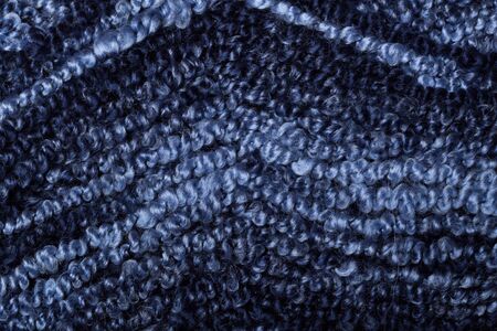 Threads densely reeled up on the coil.