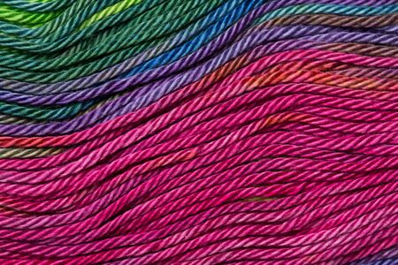 Threads densely reeled up on the coil.