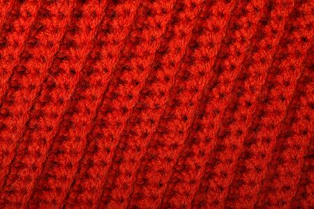 Red knitted wool texture can use as background.