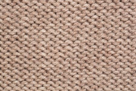 knitted fabric background texture is white. Ornament.