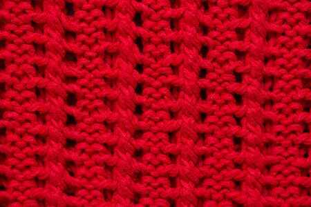 Texture of the knitted fabric background. Ornament.