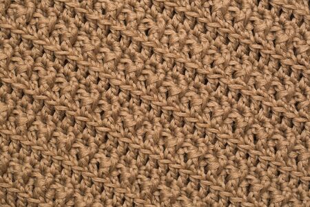 knitted fabric background texture gold. Knitted ornament