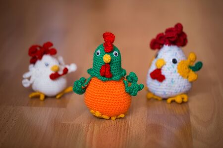 Knitted cock, isolate. Textile decoration for interior design or Christmas tree. Perfect for a gift.の写真素材