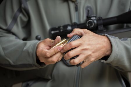Loading ammunition into a clip. Reloading weapons.