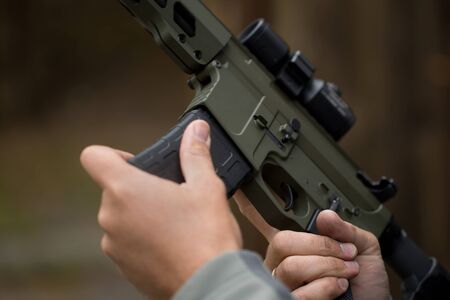 Loading ammunition into a clip. Reloading weapons.
