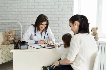 Pediatrician Meeting With Mother And Child In Hospital.の写真素材