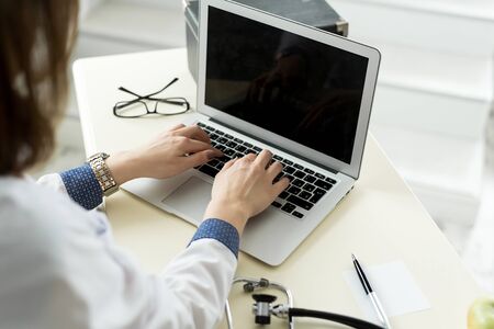 Female doctor at work in clinic officeの写真素材
