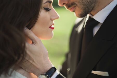 Bride and groom in the green forest.の写真素材
