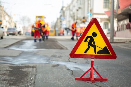 Warning street sign on road work site.の写真素材