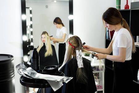 Process of dyeing hair at beauty salon.の写真素材