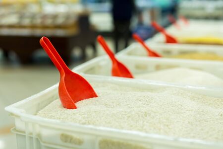 Rice and other cereals on the counter in the supermarket. buying groats in the storeの写真素材
