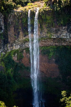 Waterfall flows into the crater of the volcano in Mauritius. National Park Chamarel.の写真素材