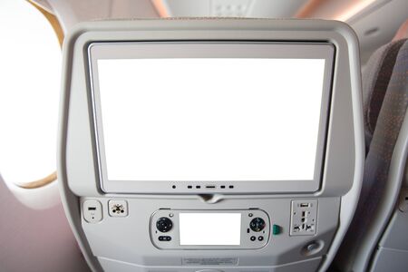 Aircraft monitor in passenger seat isolated on white background.