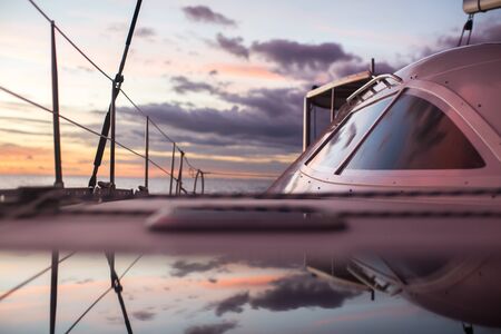 Sailing ship luxury yacht boat in the Sea during amazing sunset