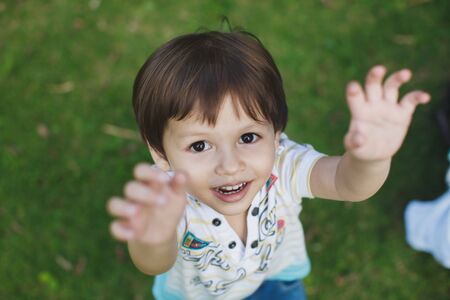 boy stretches his hands to his father.の写真素材