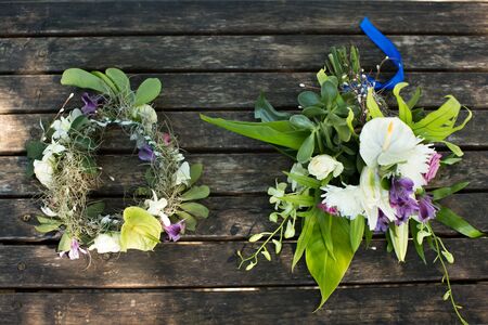 wedding bouquet and wreath on a wooden tableの写真素材