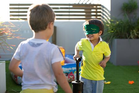 Child pump inflates balloons at a kids birthday party.