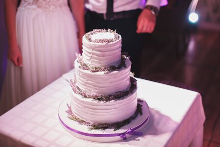 Wedding cake at the Banquet. Cutlery. delicious sweet dessert.の写真素材