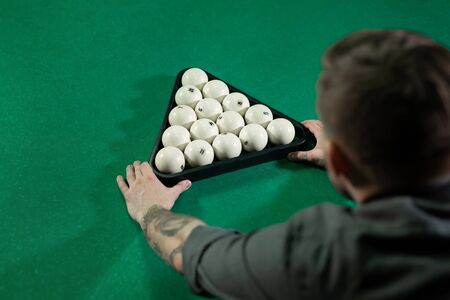 Billiard balls arranged in a triangle viewed from aboveの写真素材