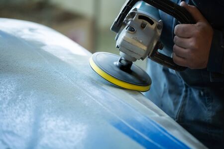 Sanding polishing of the bumper on the car at a hundred close-up.の写真素材