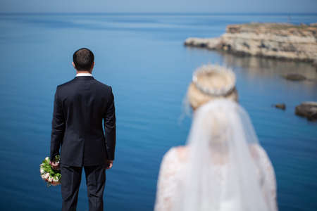 meeting of the bride and groom on a cliff.の写真素材