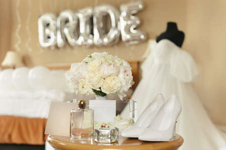 Chic wedding dress and veil on a mannequin in the bride s gathering roomの写真素材