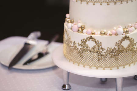 Beautiful wedding cake for the newlyweds at the wedding. A birthday cake at a banquetの写真素材
