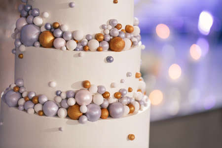 Beautiful wedding cake for the newlyweds at the wedding. A birthday cake at a banquetの写真素材