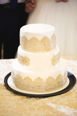 Beautiful wedding cake for the newlyweds at the wedding. A birthday cake at a banquetの写真素材