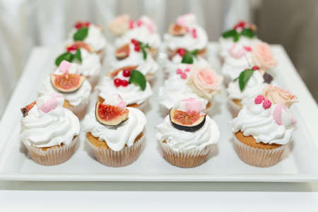 Buffet and candy bar at a wedding in a restaurantの写真素材