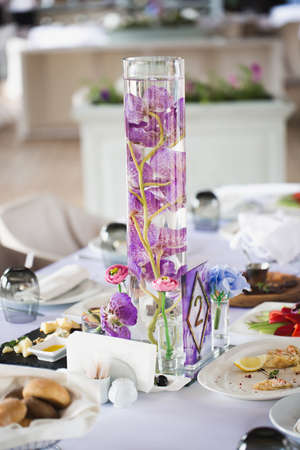 Served wedding banquet table with dishes in the restaurant.