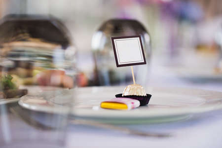 Serving a wedding banquet table in a restaurant with initials, name and dateの写真素材
