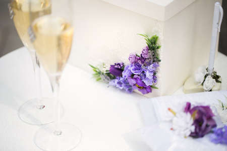 Wedding glasses with champagne on the table.の写真素材