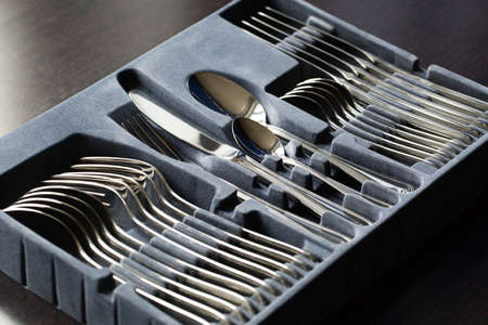 Blue flatware box isolated on black background.の写真素材