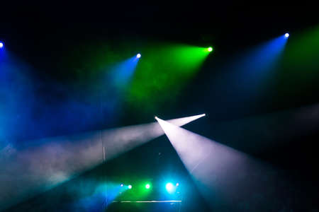 beautiful light spotlights in the circus on a black background.の写真素材