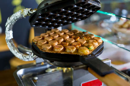 Machine made bubble waffle at shop, Hong Kong bubble waffle.の写真素材
