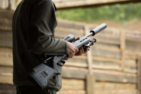Military holds weapons in the hands of.